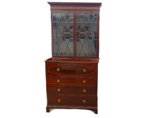 A George III mahogany secretaire bookcase, the twin astragal glazed doors enclosing three shelves, the base section with fitt