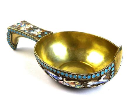 A Russian enamel and silver gilt Kovsh, late 19th century, of typical form decorated with polychrome shaded flowers and scrol