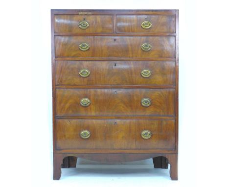 A late George III tall chest of two over four drawers, with brass plate handles, divisible into two sections for transport, r