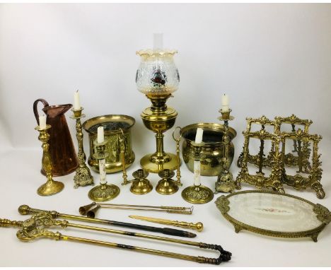 A collection of copper and brass items, including candlesticks, jardiniere, oil lamp, 58 by 20cm, pitcher, bed warming pan, c