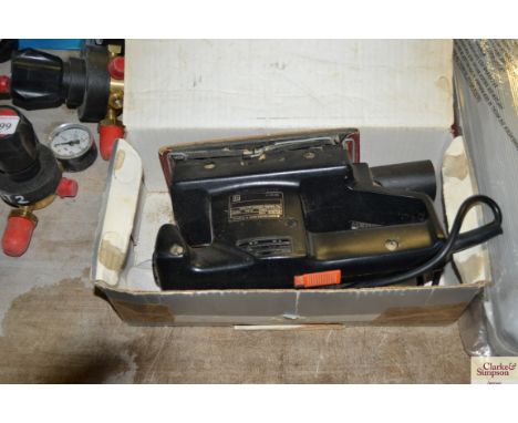 A Black and Decker electric sander