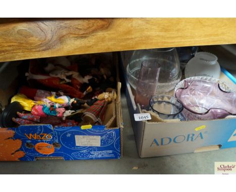 Two boxes containing souvenir dolls and various glassware to include amethyst coloured vase and bowl; cut glass vase etc. 