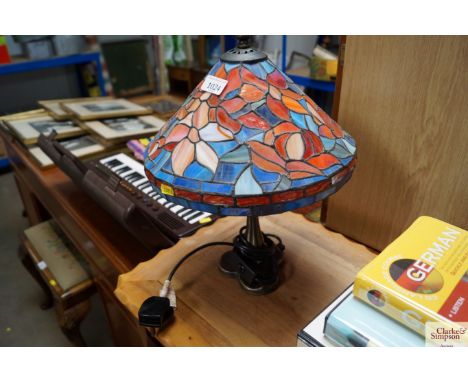 A Tiffany style table lamp and shade