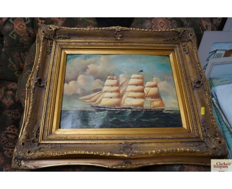 An oleograph depicting a three mast sailing ship contained in ornate gilt frame