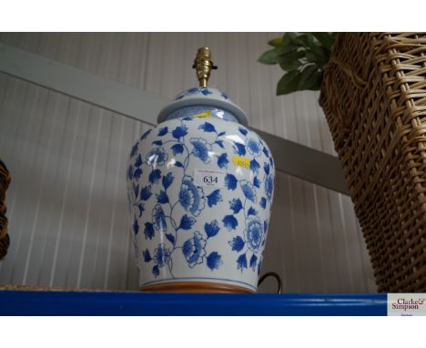 An Oriental decorated table lamp lacking shade