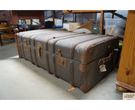 A metal bound travelling trunk 