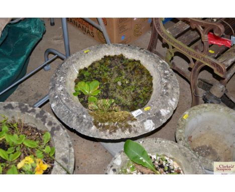 A large concrete garden planter
