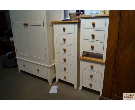 A light oak topped chest of narrow proportions fitted six drawers
