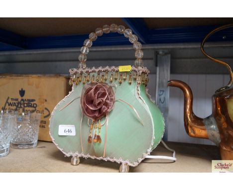 A table lamp in the form of a lady's handbag