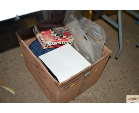A box of motoring spares to include electrical test and tune up timer; hub cap etc