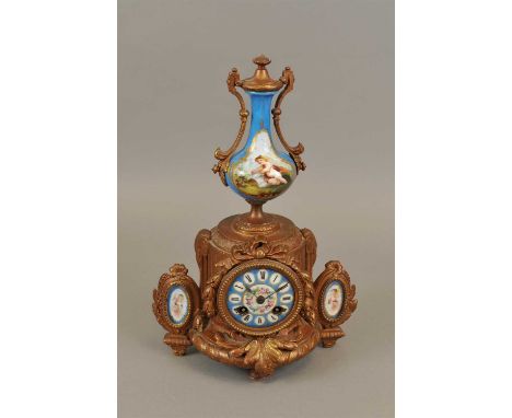 A late 19 th century French cast metal mantle clock with hand painted porcelain mounts, the powder blue porcelain dial with w