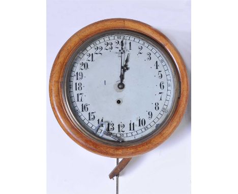 An Edwardian 24 hour wall clock, the 12" silvered dial with black Arabic numerals, marked 'Greenwich Mean Time', glazed in a 