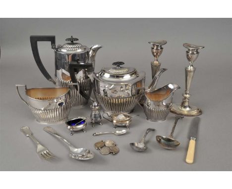 A large collection of silver plated wares, to include; cutlery, cruets, a circular platter/tray, a pair of candlesticks, tea 