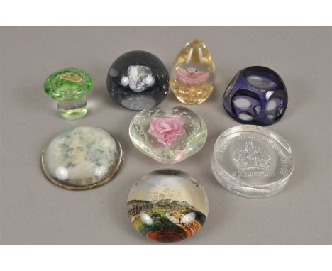 An assorted collection of glass paperweights 20th/21st century, including Strathearn examples, an Elizabeth Queen II 80th Bir