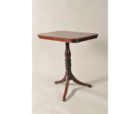 A 19 th century mahogany tablet topped tripod table, raised on a turned column over swept legs, 71 cm high, the top measuring