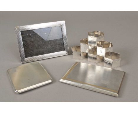 Two engine turned silver cigarette cases, Birmingham, total weight approx 10.2oz, together with a silver mounted photograph f