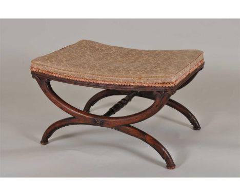 A Regency rosewood x framed upholstered stool, the fixed cushion seat above a fluted frieze raised on an x shaped frame with 