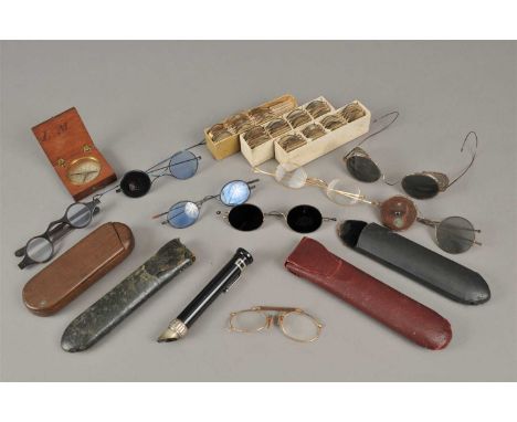 A collection of Victorian and later spectacles to include pressed horn, gold plated and other examples, together with leather