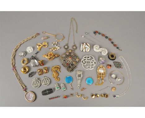 A collection of costume jewellery; to include; a graduated hardstone necklace, a paste set Art Deco clip, a yellow metal text