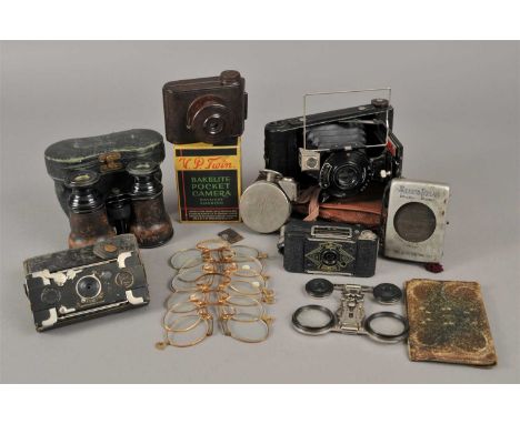 An interesting photographic / optical collection to include a Houghtons Ticka Pocket Watch style sub miniature camera, a mini