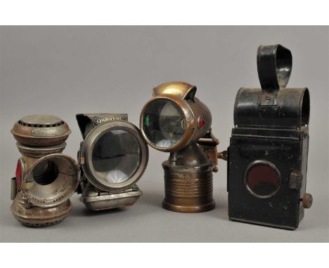 A collection of early 20th century bicycle lamps to include a Joseph Lucas Silver King example, an acetylene gas lamp and ano