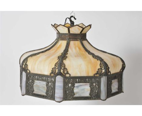 A large marbled leaded glass light / lamp shade in the manner of Tiffany, of tapering octagonal form with scrolling and pierc