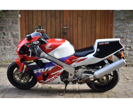 A 1997 Honda RVF 750 RC45, registration number R10 RVF, frame number RC45-2100095, engine number RC45E 410026, red/white/blue