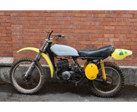 A 1972 Suzuki TM250 twin shock scrambler project, yellow. This TM has come out of long term storage and requires full restora