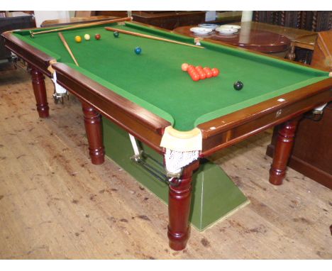 3/4 size slate bed snooker table on six turned legs with overhead light, balls, cues and accessories