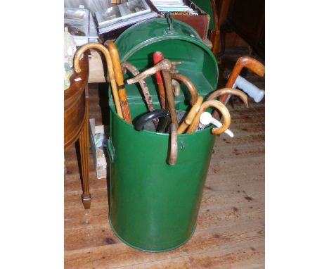 Vintage oil drum and collection of walking sticks