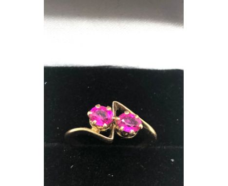 18ct gold ruby ring set with t rubies each measure approx 4mm by 3.5mm weight of ring 3g 