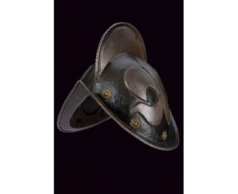 dating:  provenance: Germany, Skull in two halves, joined at the comb, which border has a twisted engraving and edge with a r