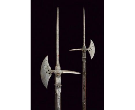 dating: 16th Century provenance: Swiss, Iron cusp of square section on a rectangular block at the base; convex-edged axe with