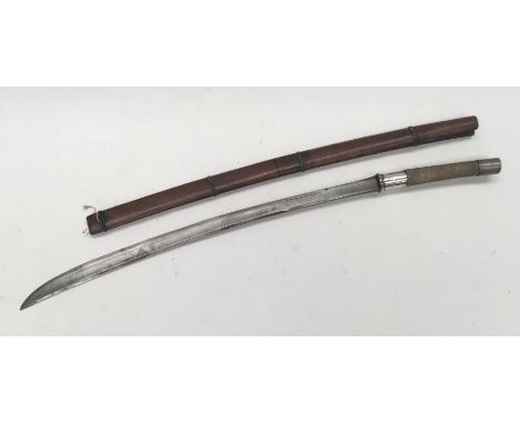 A 19th century Burmese Sword (Dha). Fish skin grip with nickel pommel and white metal / silver guard. Steel slightly curved s