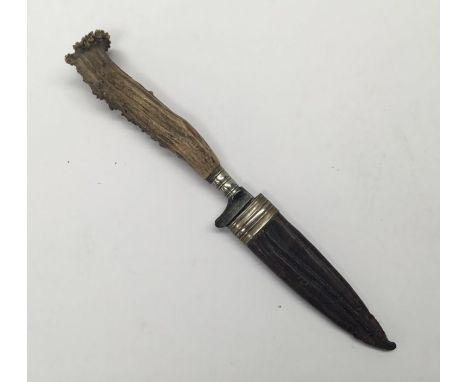 A late 19th / early 20th century German made sheath knife. Antler handle with silver plated mounts. Steel single edged blade,