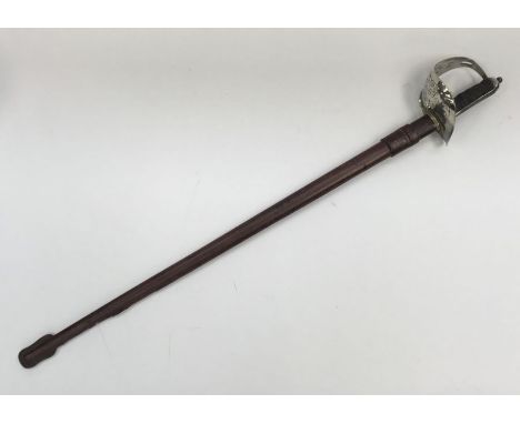 An 1897 pattern infantry officers sword by Fenton Brothers Ltd, Sheffield. Pierced nickel plated steel guard, with crown and 