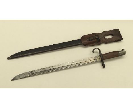 A WW2 era Japanese 1897 pattern type 30 bayonet and frog. Steel cross guard with pre-1943 J shaped quillon, wooden slab grips