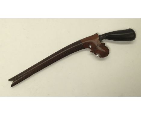 A late 19th / early 20th century Malayan Bade Bade knife. Hardwood ebonised handle, with single edged long and narrow steel b