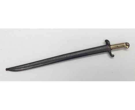 A French 1842 pattern Yatagan sword bayonet. Ribbed brass grip with beak shaped pommel. Push button release catch for attachi