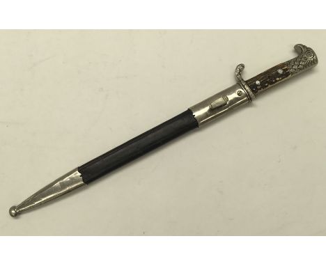 WW2 era German police bayonet, with associated scabbard. Standard antler grips and eagle headed pommel, Oak leaf patterned cr