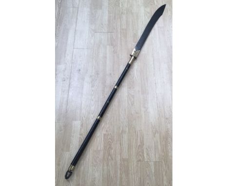 A 19th century, or possibly earlier Chinese Pudao or ‘horse cutter’ broadsword. Stained wooden shaft with iron ring finial, s