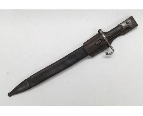 A 19th century Italian M1870 1st pattern Vetterli bayonet, with associated scabbard and leather frog. Wooden slab grips, with