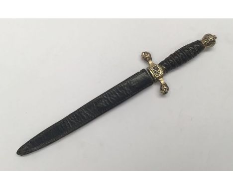 A Prussian naval dirk, with leather sheath. Leather grip with twisted wire biding, brass pommel, and brass cross guard, the l