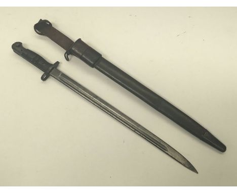 A British 1907 pattern bayonet, with scabbard and frog. Faintly date marked 3. 18 at the ricasso. GR and crown marked, along 