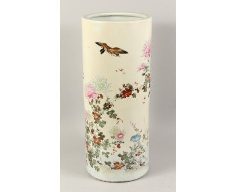 A LARGE JAPANESE PORCELAIN STICK STAND painted with flowers. 24ins high.