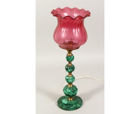 A 19TH CENTURY ONYX LAMP BASE with ruby glass shade. 12ins high.