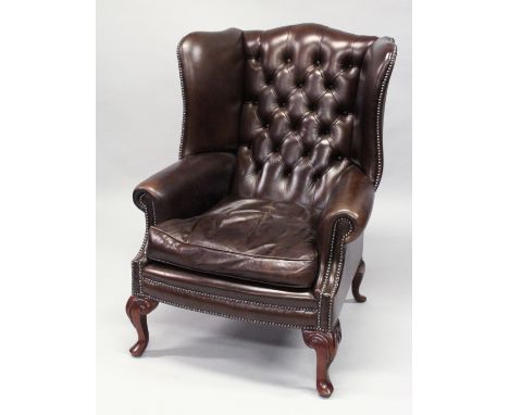 A GOOD GEORGE III DESIGN BROWN LEATHER, BUTTON UPHOLSTERED WING ARMCHAIR, on cabriole legs.