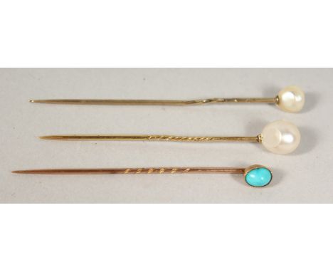 THREE PEARL TIE PINS, cased.