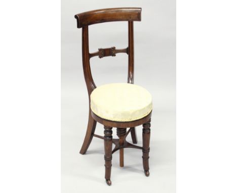 A 19TH CENTURY MAHOGANY MUSIC CHAIR, with overhanging cresting rail, carved tie bar, over-stuffed revolving seat on turned fr