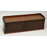 A LONG MAHOGANY TAMBOUR CABINET. 3ft 5ins long 11ins deep, 1ft 2ins high.